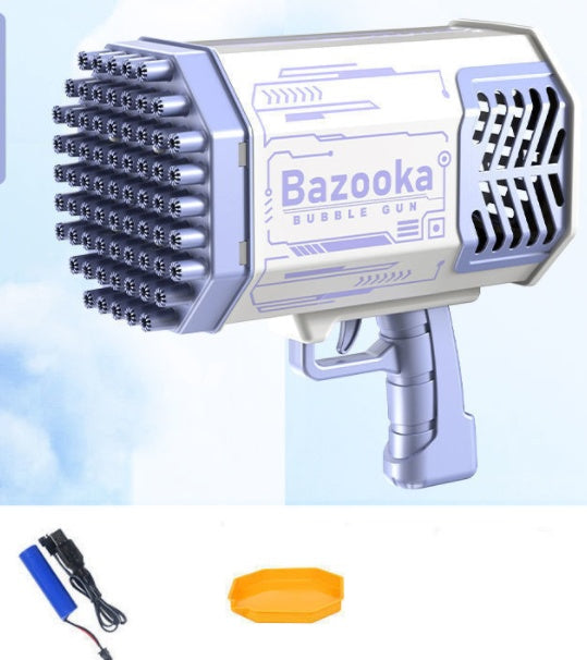 Pistolet à bulles blanc et violet avec ses ouvertures en façade, présenté avec une batterie, un câble de recharge et un plateau jaune .