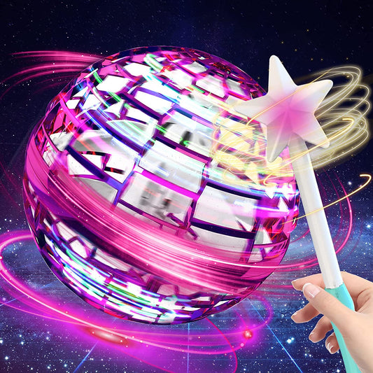 Balle volante LED rose avec des effets lumineux multicolores et une baguette en forme d’étoile tenue en main.
