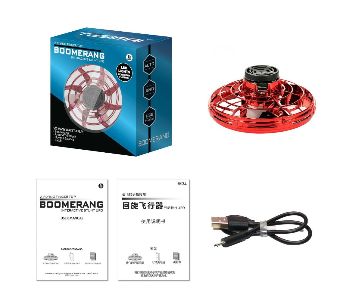 Toupie volante rouge présentée avec une boîte, des notices et un câble de recharge USB .