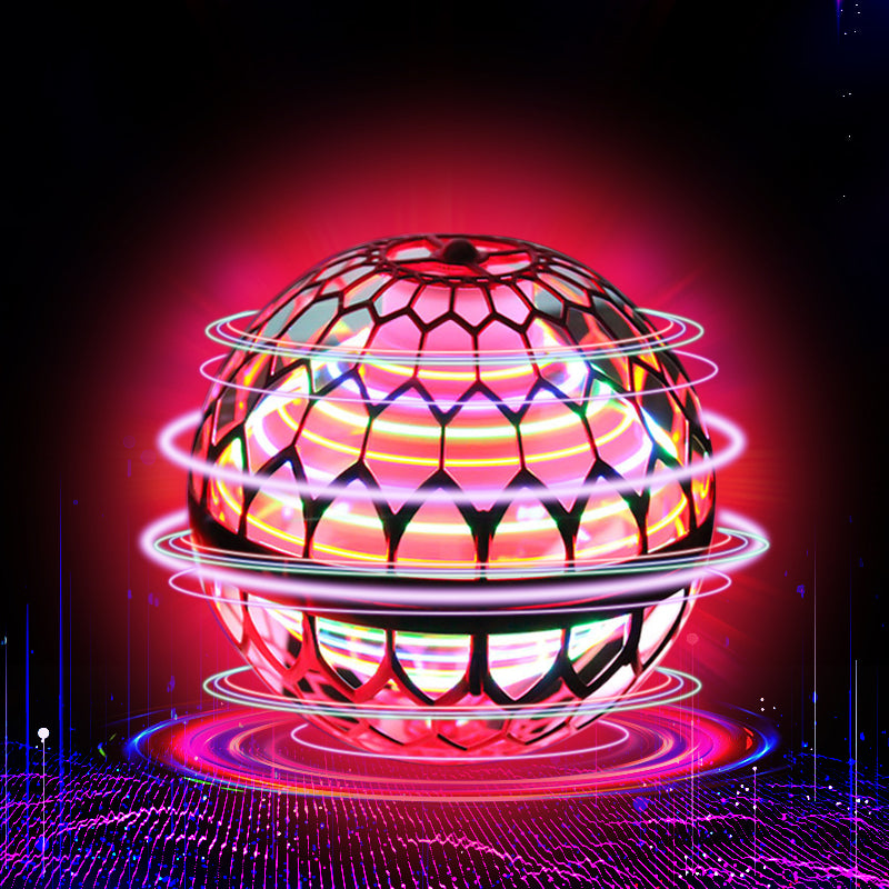 Balle volante LED rouge avec des anneaux lumineux multicolores et un halo rose sur fond sombre.